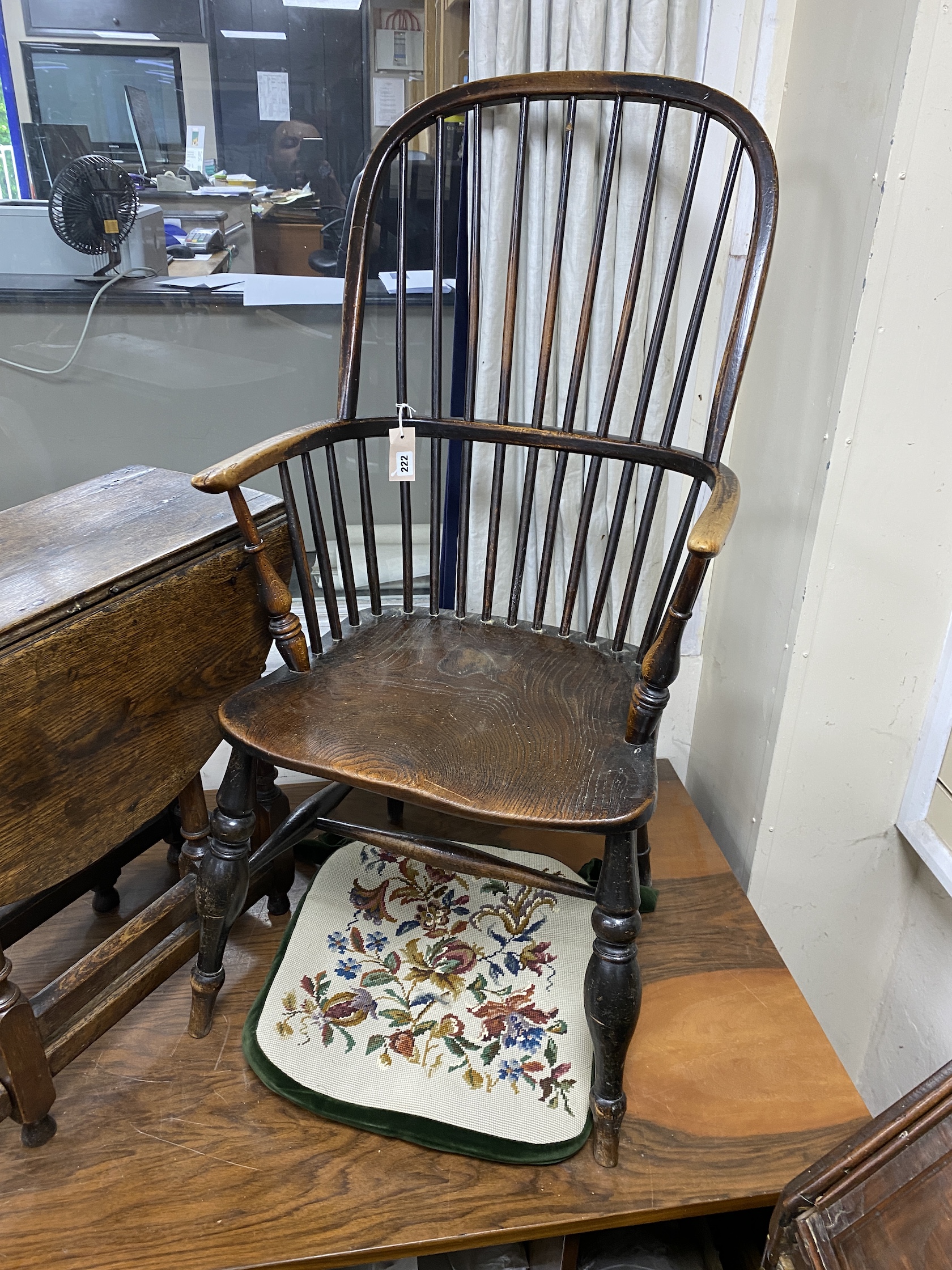 An early 19th century Windsor elm and beech comb back armchair, width 48cm, depth 43cm, height 110cm